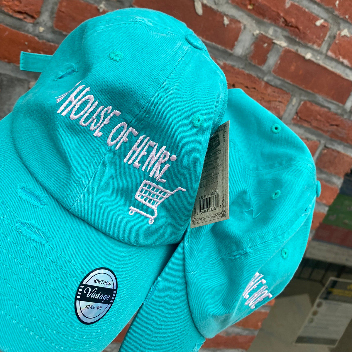 Cap “signature hair store” logo. THE HOUSE OF HENRI